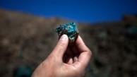 Courtesy of www.npr.org The mine at Oyu Tolgoi, Turquoise Hill in Mongolian, will be one of the world's largest copper mines in about five years. An employee holds up a small sample of the oxidized copper that gave the mine its name.